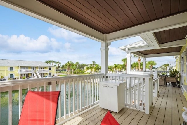 wooden terrace with a water view