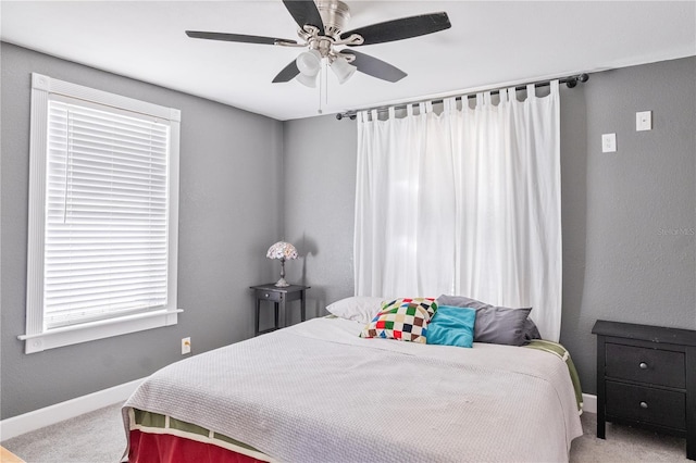 bedroom with ceiling fan and carpet floors