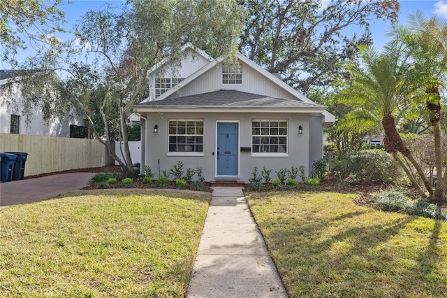 bungalow with a front lawn