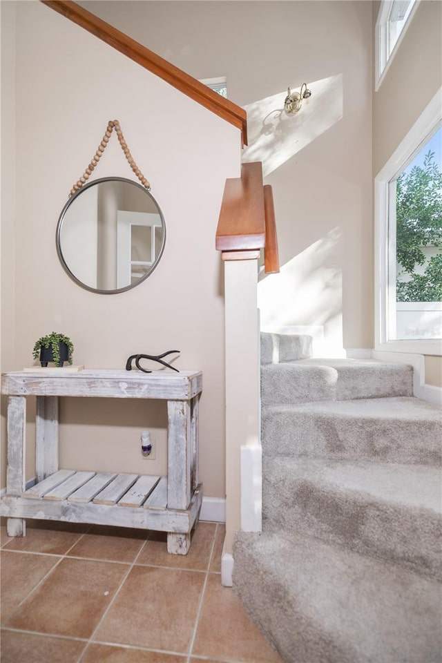 stairway featuring tile patterned floors