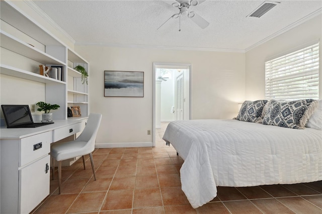 tiled bedroom with ceiling fan, crown molding, built in desk, and a textured ceiling