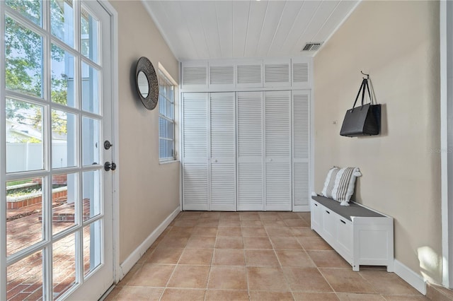 doorway to outside featuring light tile patterned floors