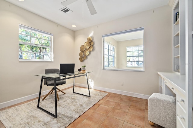 home office featuring tile patterned flooring, visible vents, baseboards, and ceiling fan