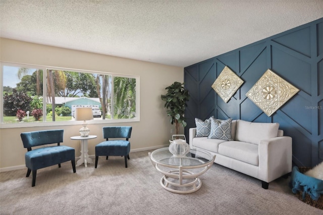 living room featuring carpet, a healthy amount of sunlight, and a textured ceiling