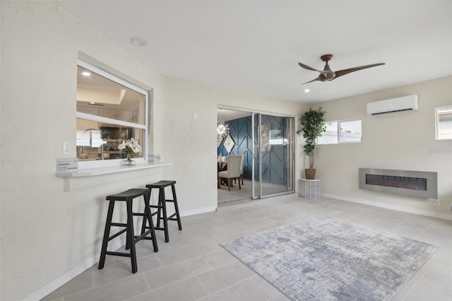 living room with ceiling fan, an AC wall unit, light tile patterned floors, and lofted ceiling