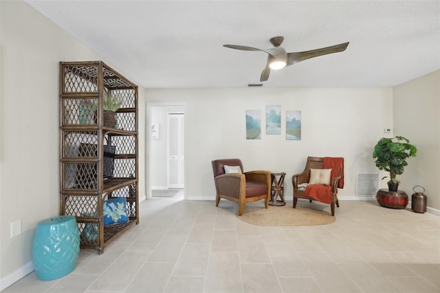 living area with ceiling fan