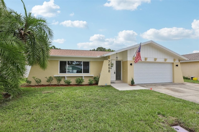 ranch-style home with a garage and a front yard