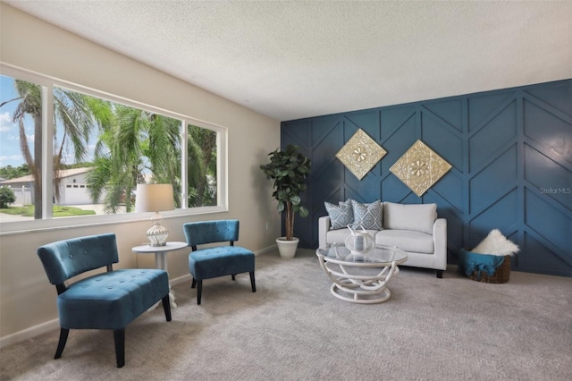 carpeted living room featuring a textured ceiling