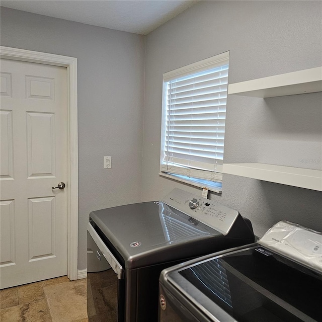 laundry area with separate washer and dryer