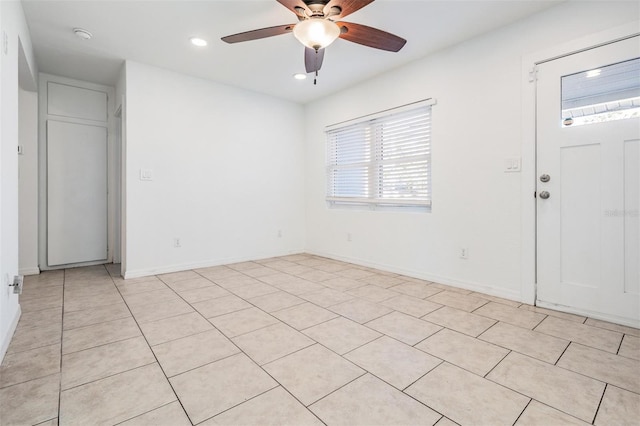 entrance foyer featuring ceiling fan and light tile patterned flooring