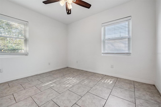 unfurnished room featuring ceiling fan and light tile patterned floors