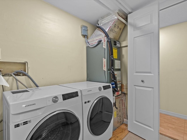 clothes washing area featuring washer and dryer