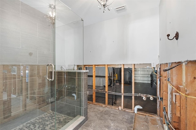 bathroom with a shower with door