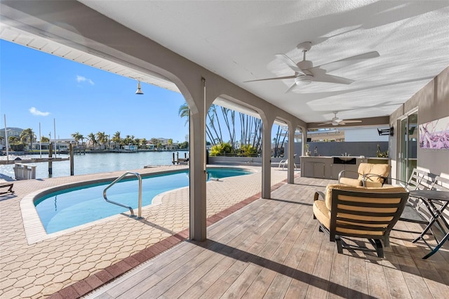 view of pool featuring a water view