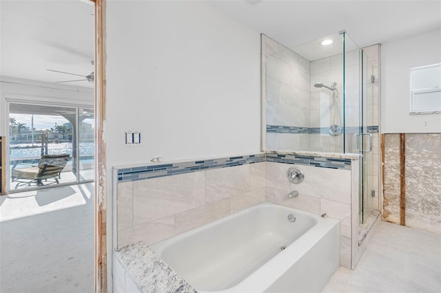 bathroom featuring separate shower and tub