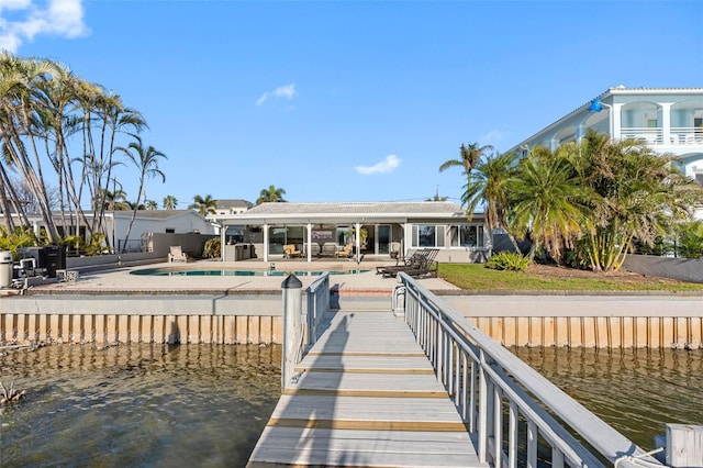 dock area with a patio and a water view