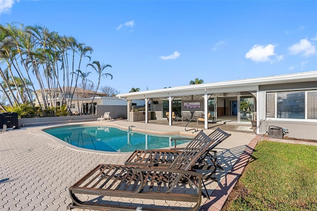 view of swimming pool featuring a patio area