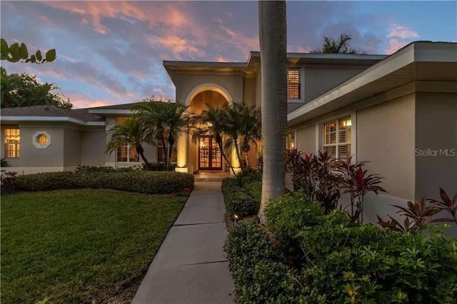 view of front of property with a yard