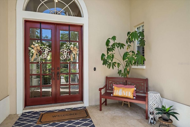 view of exterior entry featuring french doors