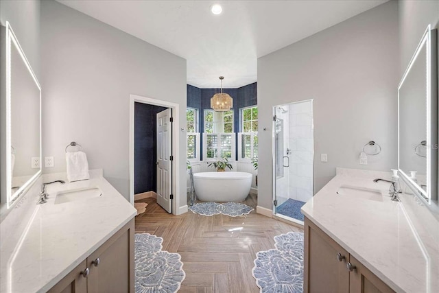 bathroom featuring plus walk in shower, vanity, parquet floors, and a notable chandelier