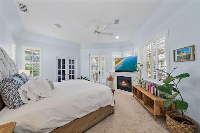 bedroom featuring ceiling fan and french doors