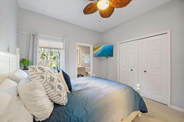 carpeted bedroom featuring connected bathroom, a closet, and ceiling fan