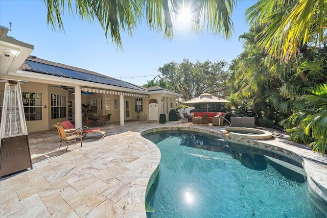 view of swimming pool featuring an in ground hot tub, ceiling fan, a patio, and an outdoor hangout area