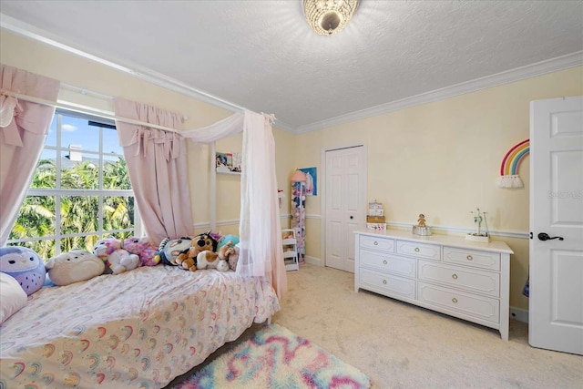 carpeted bedroom featuring crown molding and a textured ceiling