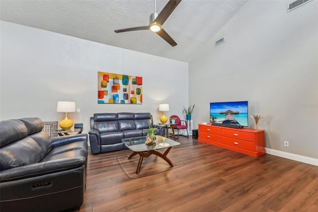 living room featuring ceiling fan, dark hardwood / wood-style flooring, high vaulted ceiling, and a textured ceiling