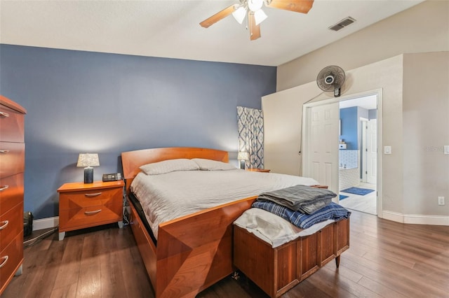 bedroom featuring ceiling fan and dark hardwood / wood-style floors