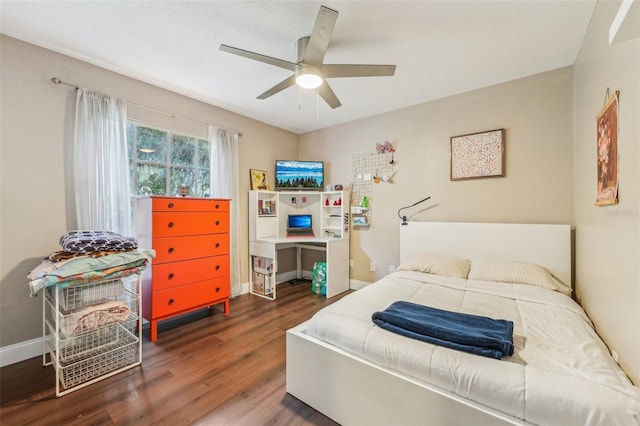 bedroom featuring ceiling fan and dark hardwood / wood-style floors