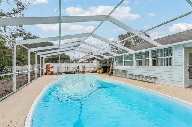 view of pool with a lanai and a patio