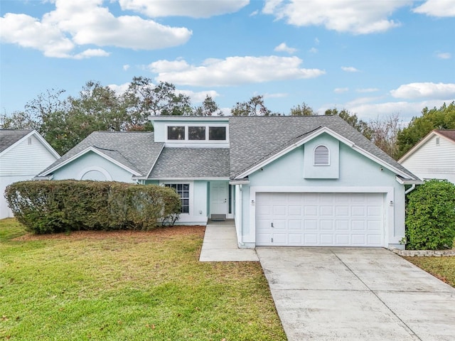 view of front of home with a garage and a front yard