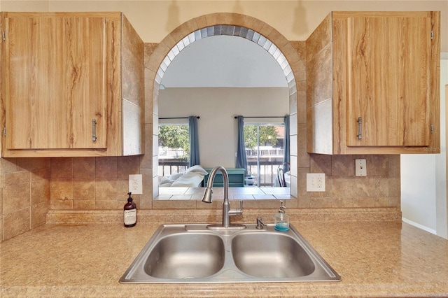 kitchen with decorative backsplash and sink