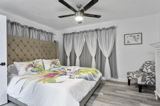 bedroom featuring ceiling fan and wood-type flooring