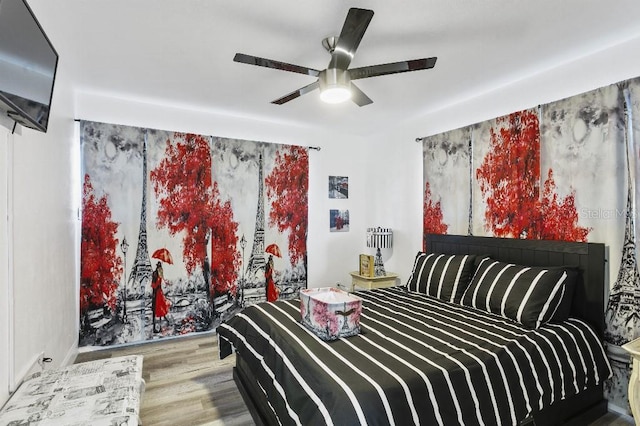 bedroom featuring wood-type flooring and ceiling fan