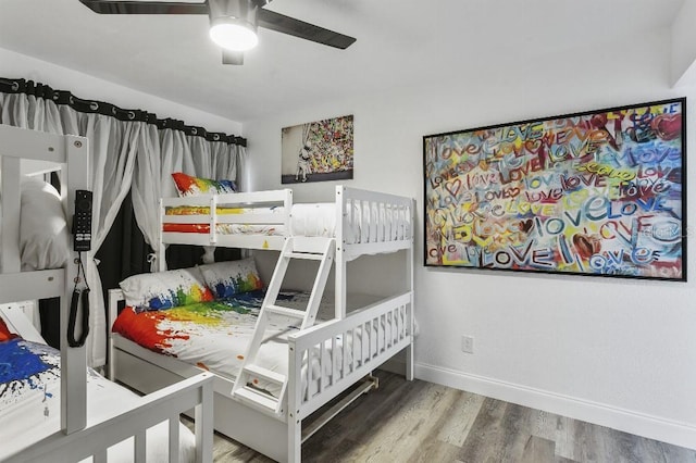 bedroom featuring hardwood / wood-style flooring and ceiling fan