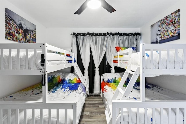 bedroom with hardwood / wood-style flooring and ceiling fan