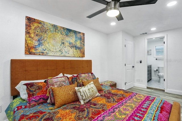 bedroom featuring connected bathroom, ceiling fan, and hardwood / wood-style floors