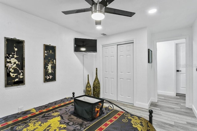 interior space with ceiling fan and light hardwood / wood-style floors