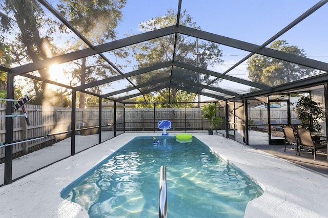 view of swimming pool with a lanai and a patio