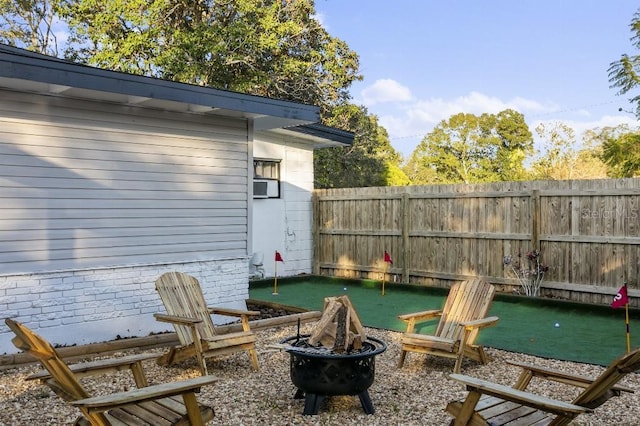 view of patio with a fire pit