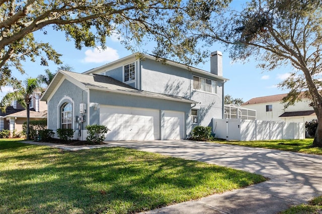 view of front facade featuring a garage and a front yard