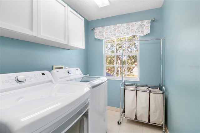 1600 Gray Bark Dr, Oldsmar, FL 34677 - clothes washing area with baseboards, light tile patterned flooring, cabinet space, and washer and clothes dryer