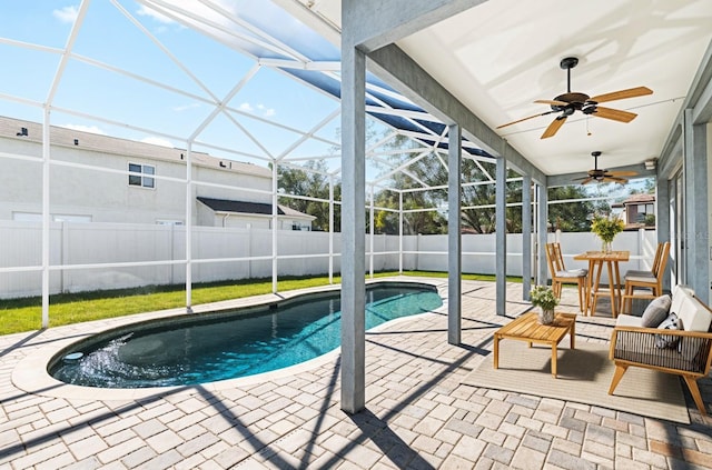 1600 Gray Bark Dr, Oldsmar, FL 34677 - view of swimming pool with ceiling fan, a lanai, a patio area, a fenced in pool, and a fenced backyard