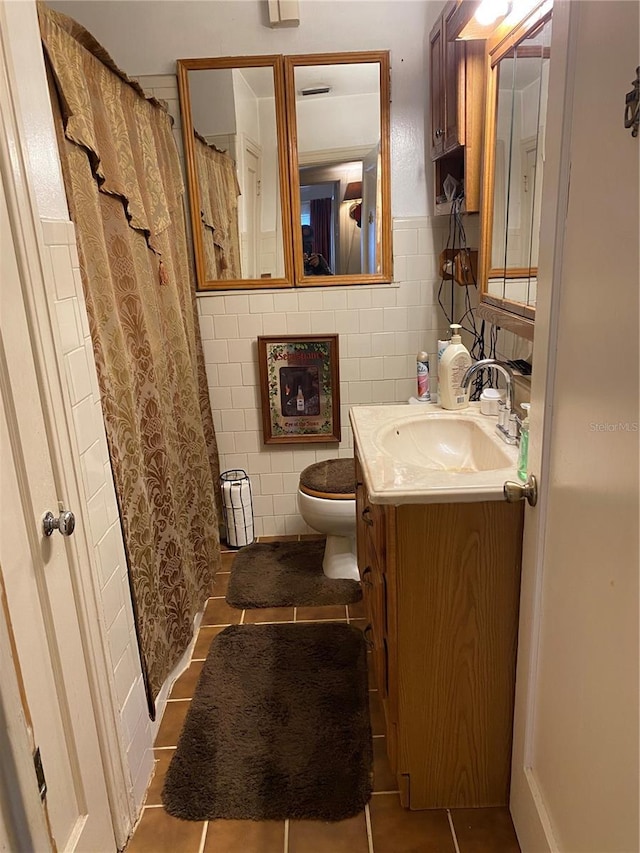 bathroom featuring tile walls, vanity, and tile patterned floors