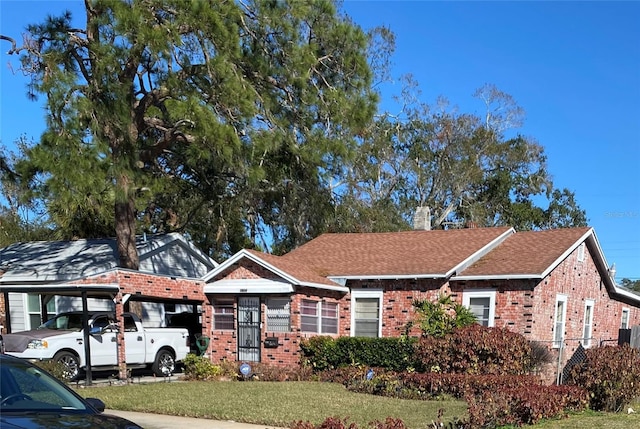 ranch-style house with a front lawn