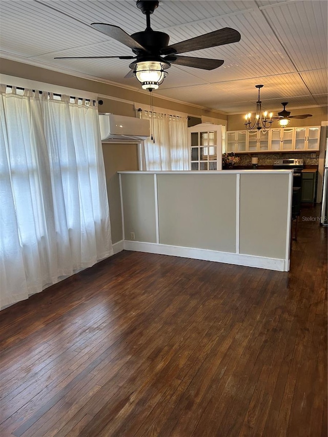 kitchen with dark hardwood / wood-style flooring, a wall mounted AC, pendant lighting, white cabinets, and ceiling fan with notable chandelier