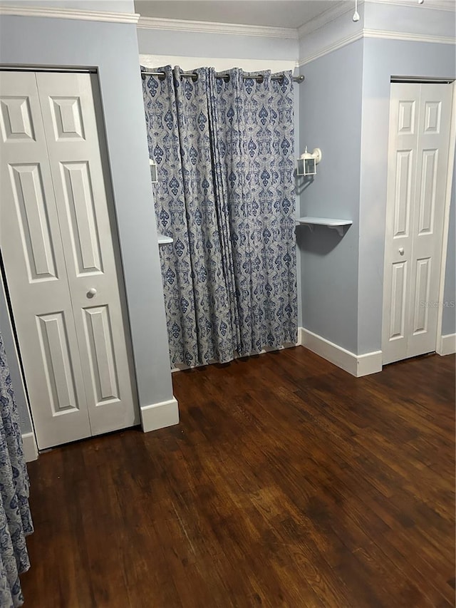 bathroom featuring hardwood / wood-style flooring and crown molding