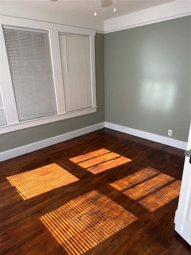 unfurnished room with hardwood / wood-style floors and ceiling fan